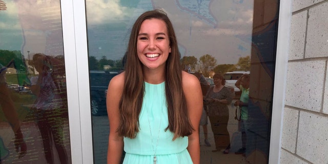 In this September 2016 file photo provided by Kim Calderwood, Mollie Tibbetts poses for a picture during homecoming festivities at BGM High School in her hometown of Brooklyn, Iowa. (Kim Calderwood via AP, File)