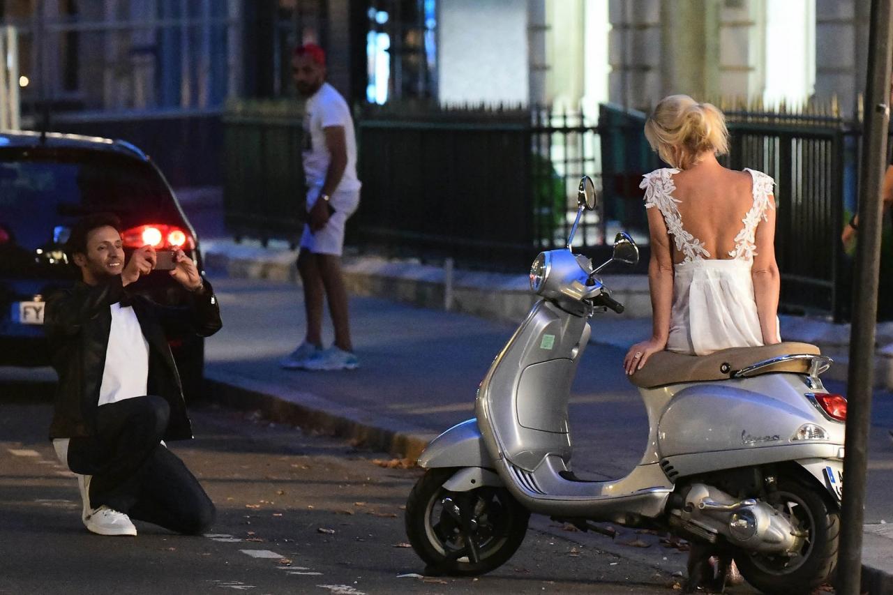 Sandra Lee posing for Ben Youcef on a scooter in Paris.