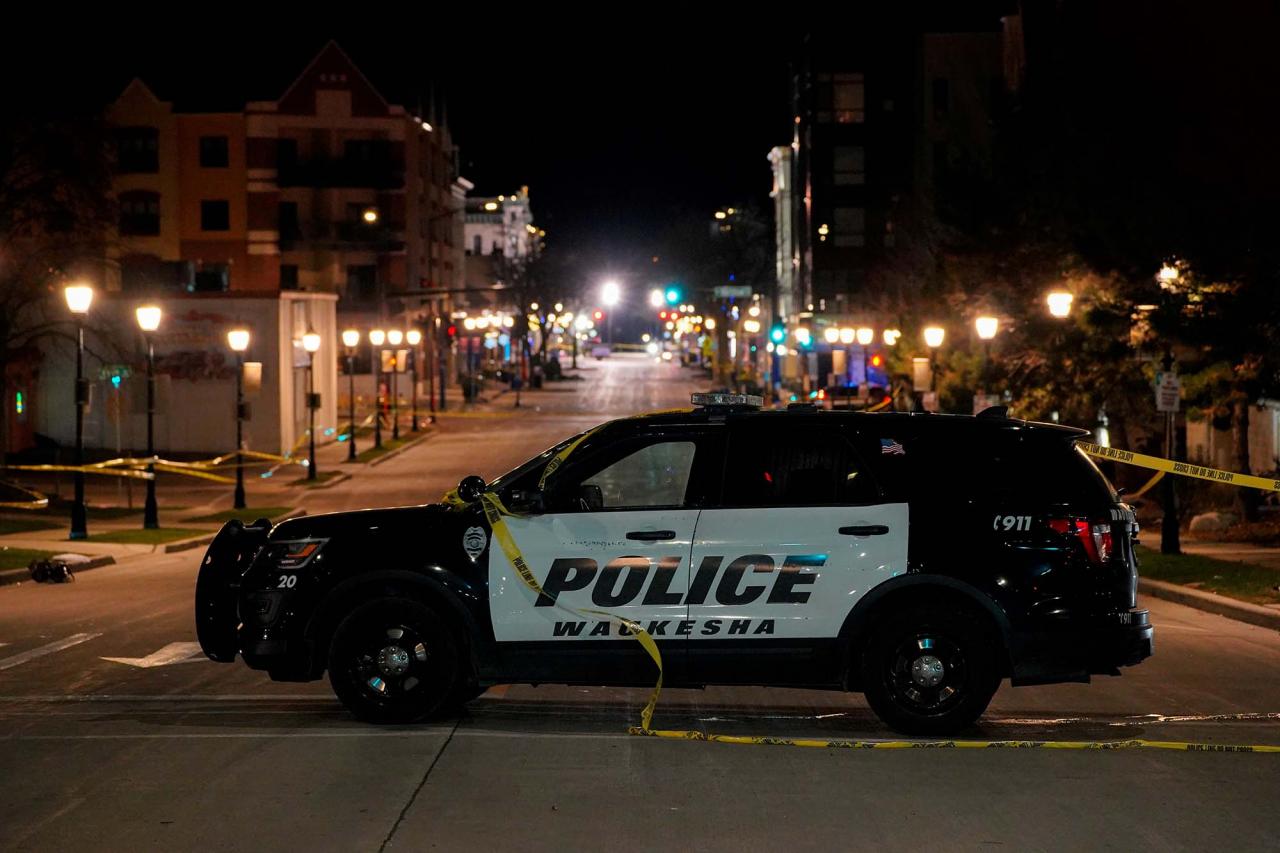 A police car is seen at Main Street in downtown Waukesha, blocking off the area after an SUV plowed through a Christmas parade.