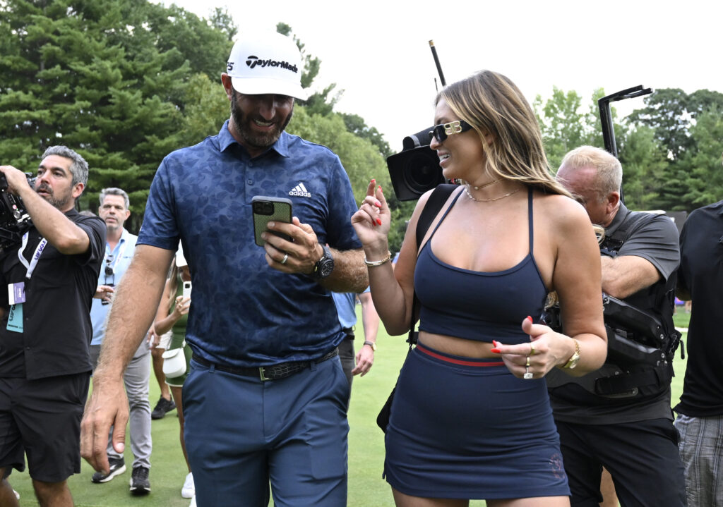 Dustin Johnson celebrates with wife, Paulina Gretzky, after winning the LIV Golf Invitational - Boston