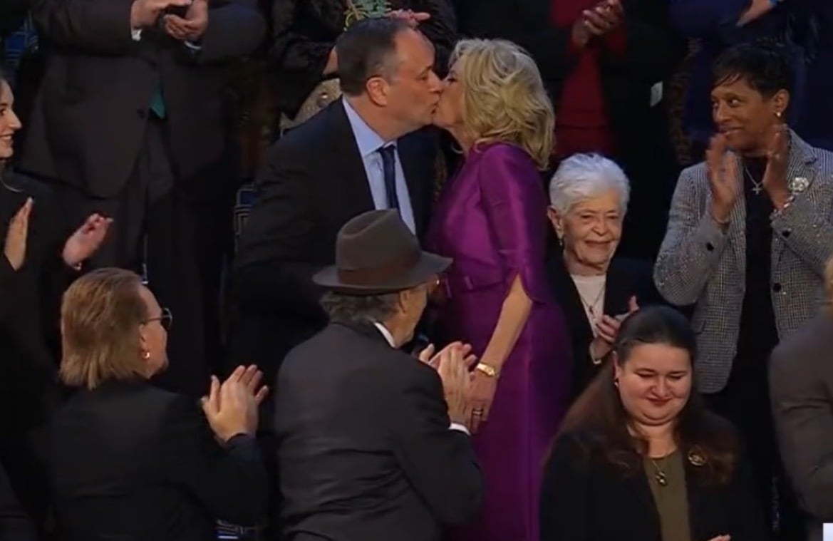 Jill Biden Looks Like a Mylar Balloon in Obnoxious Purple Shiny Dress, Gives Kamala’s Husband Awkward Kiss… on the Lips? (VIDEO)