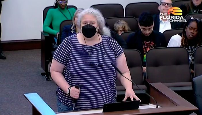 CROWD GASPS As Blue-Haired Trans Person Injects Herself While Standing at Podium to Protest Ban on Sex Changes for Children [VIDEO]