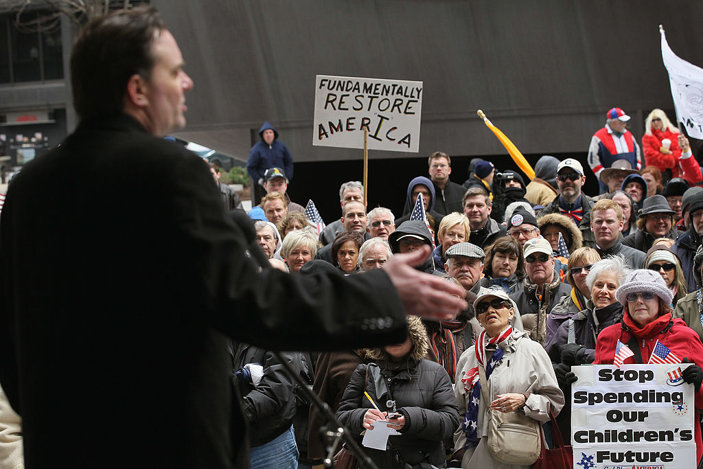 Radio talk show host Dan Proft speaks to supporters at a rally in Chicago, Illinois.