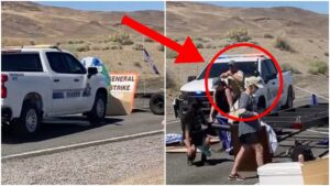 A police officer in Nevada destroyed a road blockade blocking people from getting to Burning Man. Watch a video of the incident. (Credit: Screenshot/Twitter Video https://twitter.com/MichelleLhooq/status/1695952716915450301)
