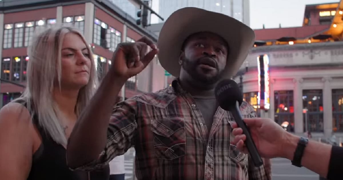 A man interviewed in a cowboy hat on a Nashville street.